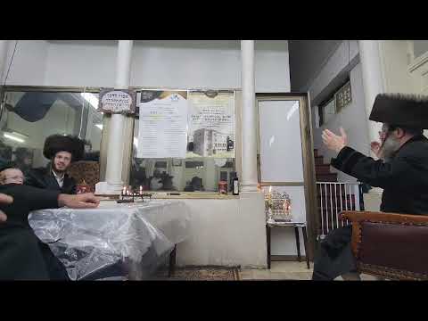 Bitchkov Rebbe Singing Next to his menorah first night chanukah 5785