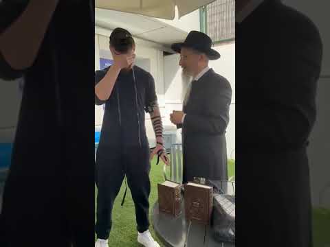 Sasha Troufanov put on Tefilin for the first time the day after returning from Hamas captivity.